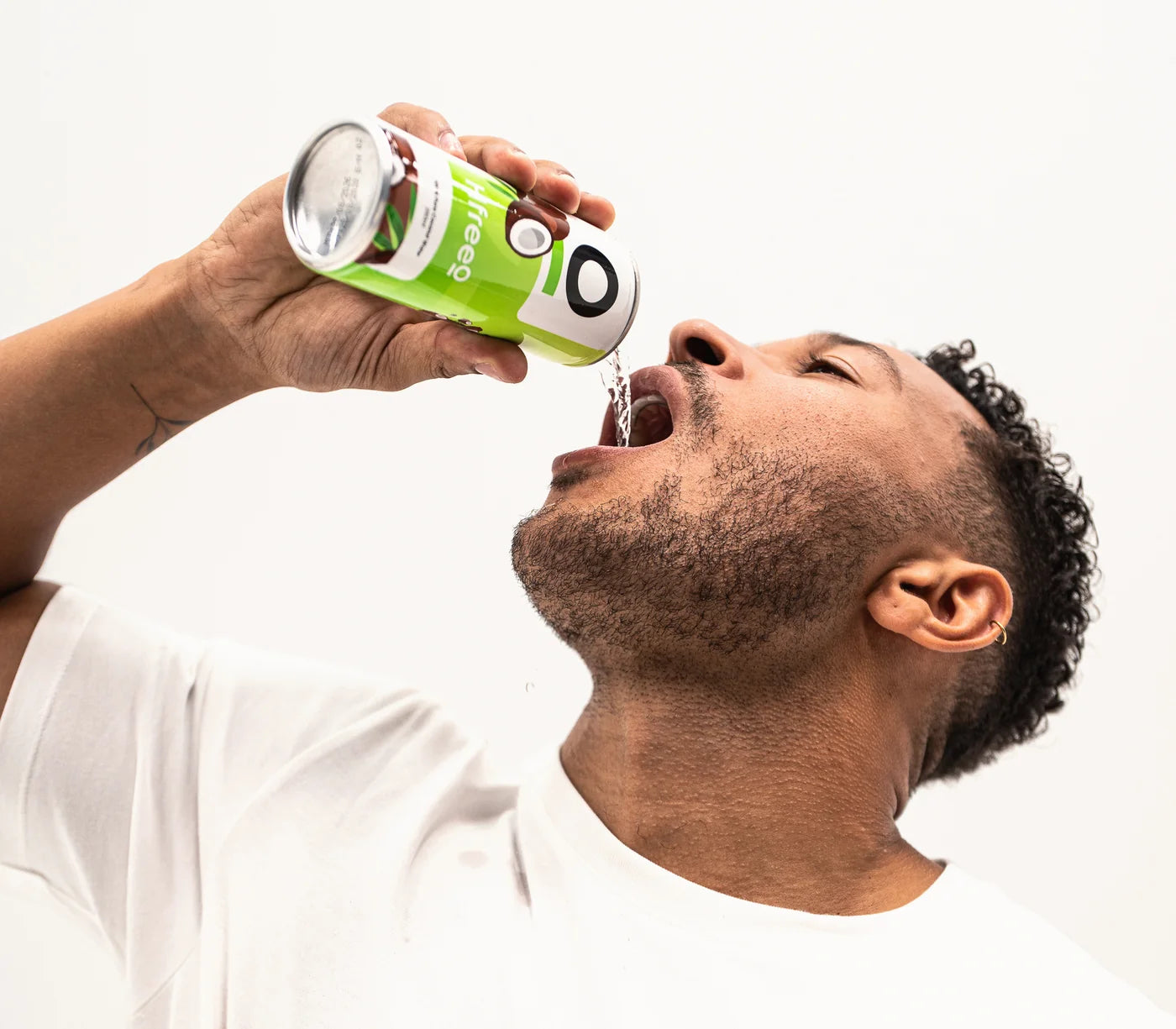 Cole Anderson-James pouring a can of HfreeO straight into his mouth.