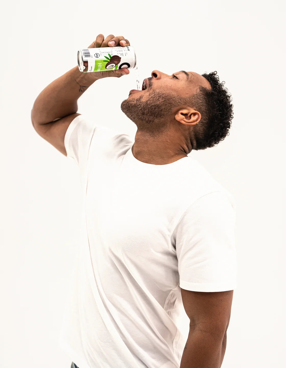 Cole, HfreeO co-founder, holding a can